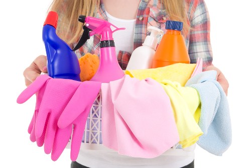 Technician preparing cleaning products and checking fabric condition
