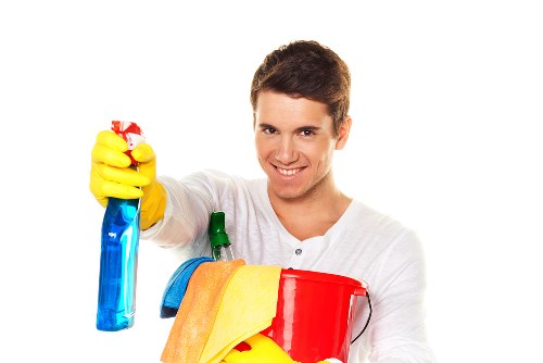 Technician wearing PPE during a carpet cleaning task